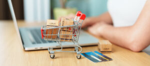 Woman Hand Holding Credit Card And Using Laptop With Mobile Phon